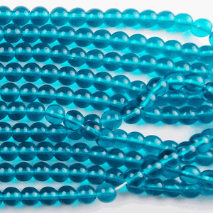 G22-156 6mm Round - Turquoise Trans.